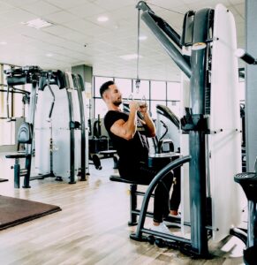 groom exercising in gym